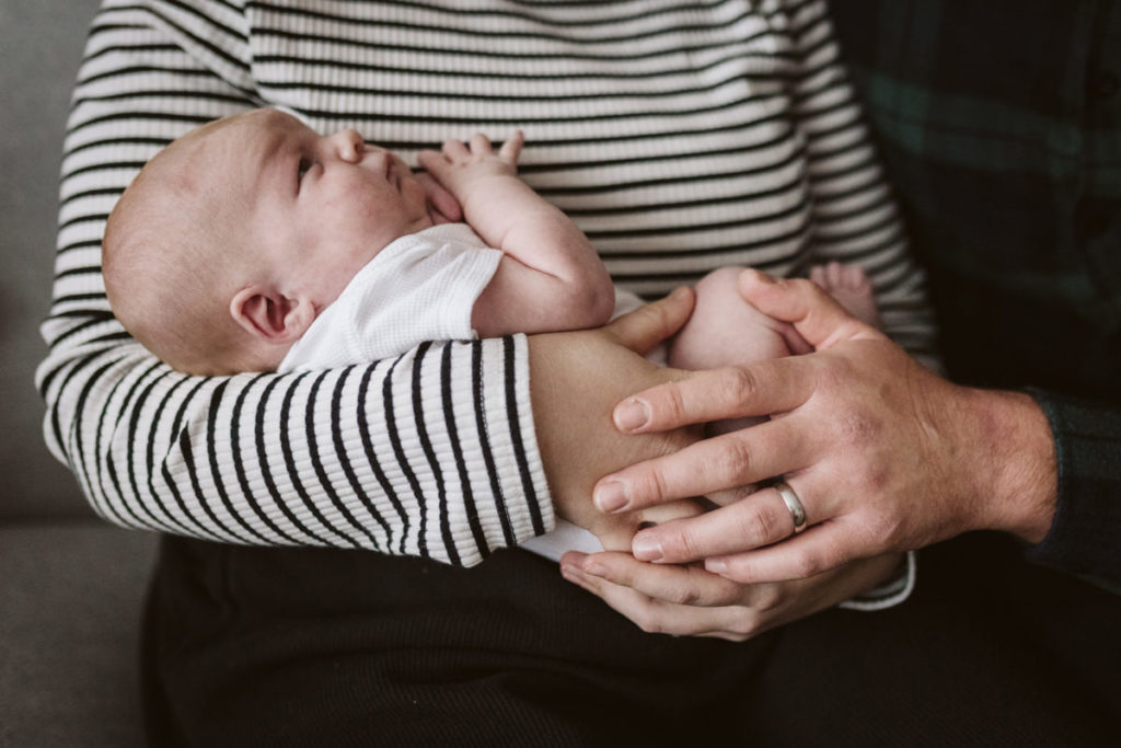 Newborn snuggles during an at home family session near Harrogate