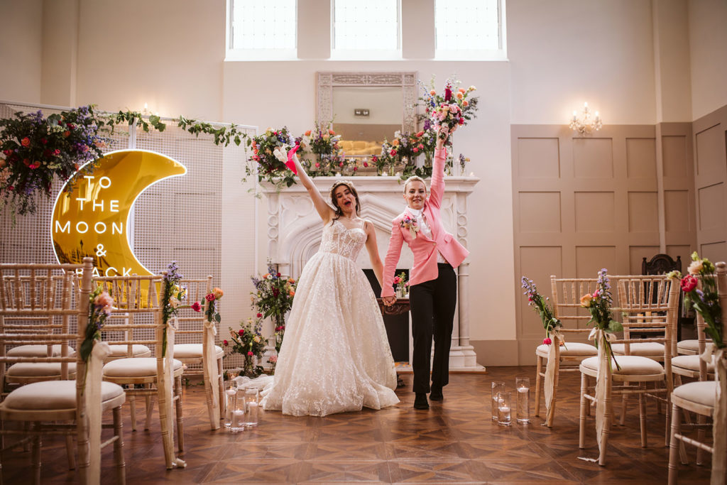 Bride and Bride walking down the aisle at Thicket Priory 