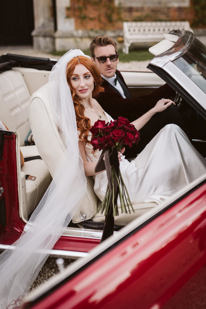 Relaxed couple portraits in the wedding car