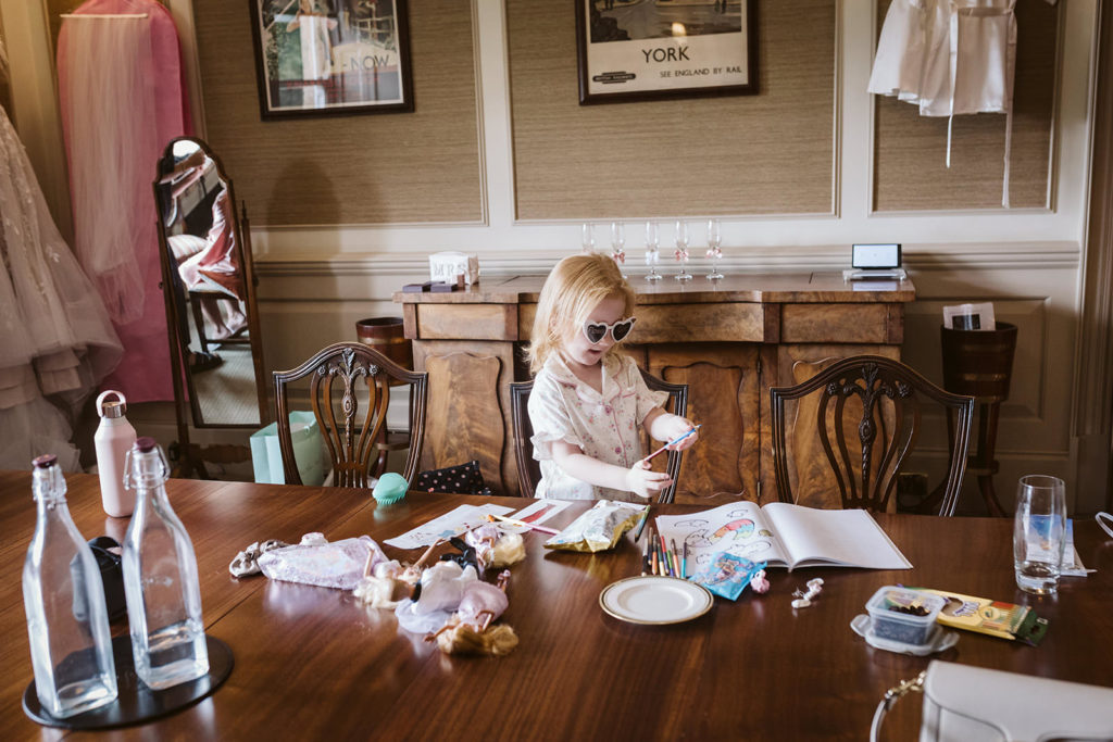 The Bride's daughter having fun during Bridal prep at Bowcliffe Hall