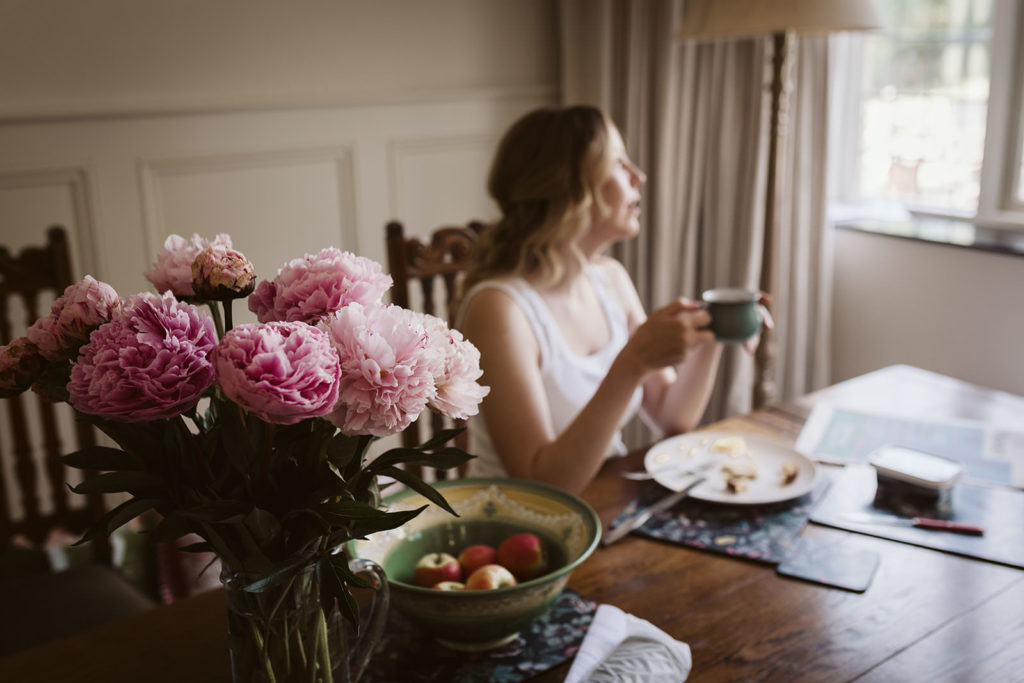 The bride to be taking a moment to herself on the wedding morning.