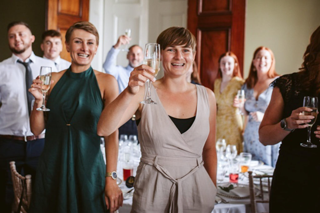 Guests laughing during wedding speeches at Rudding Park, Harrogate