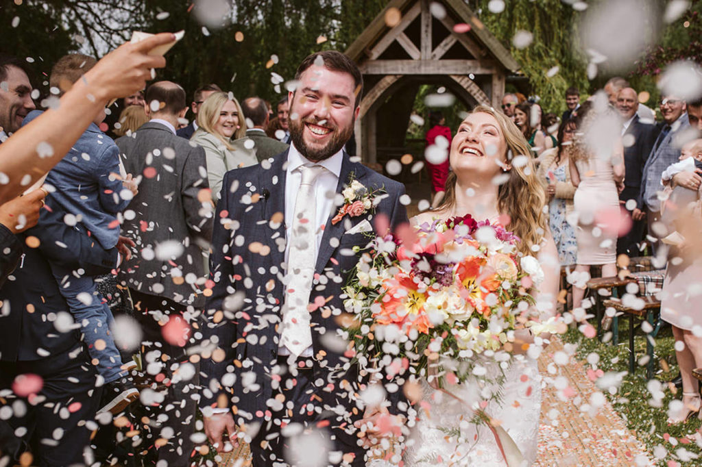 Confetti moments at outdoor wedding ceremony in North Yorkshire