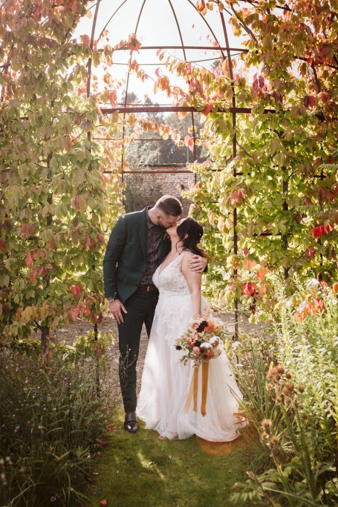 A portrait of the Bride and Groom in the Walled Garden of the Fig House, Middleton Lodge