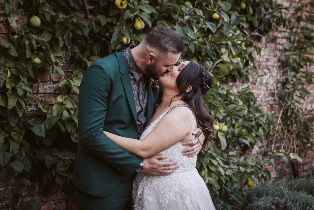 A portrait of the Bride and Groom in the Walled Garden of the Fig House, Middleton Lodge