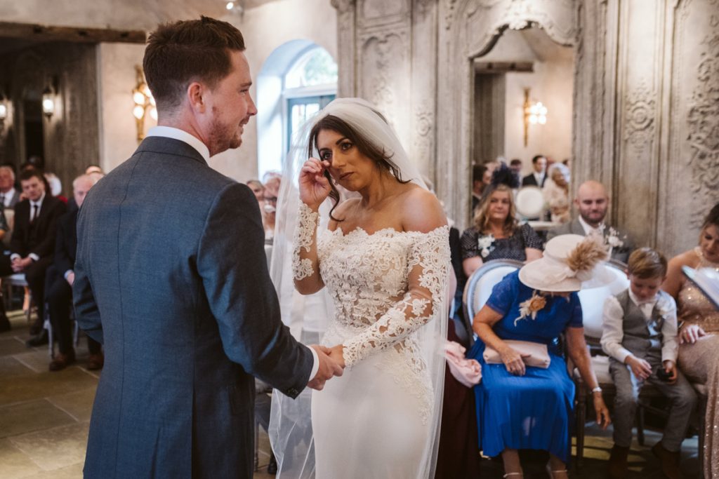 An emotional bride during her vows at this stunning Northumberland wedding venue