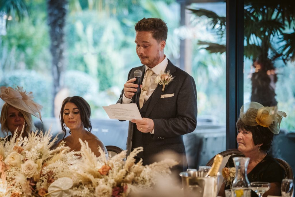 Bride's reaction during the wedding speeches at Le Petit Chateau