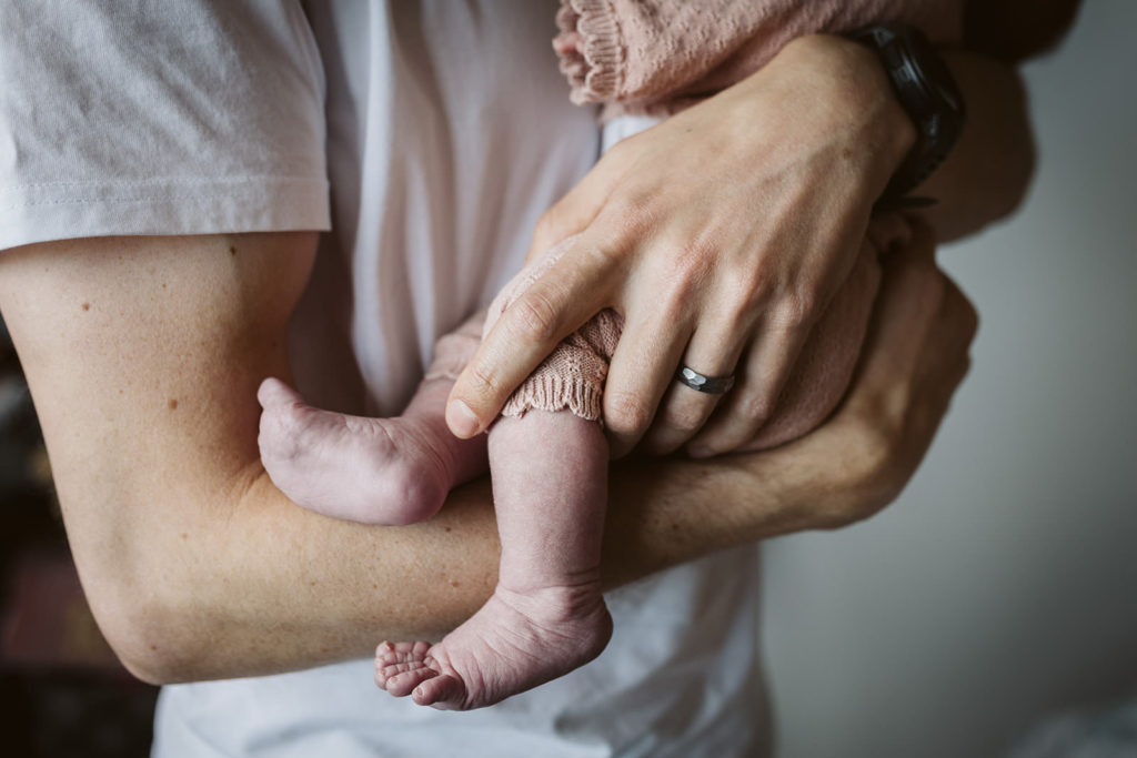 Documentary newborn shoot capturing how tiny baby's feet are