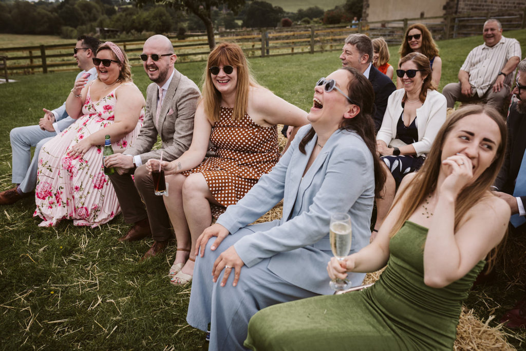 Guests enjoying a funny moment during the vows