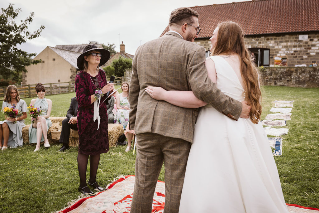 The mother of the groom doing a reading