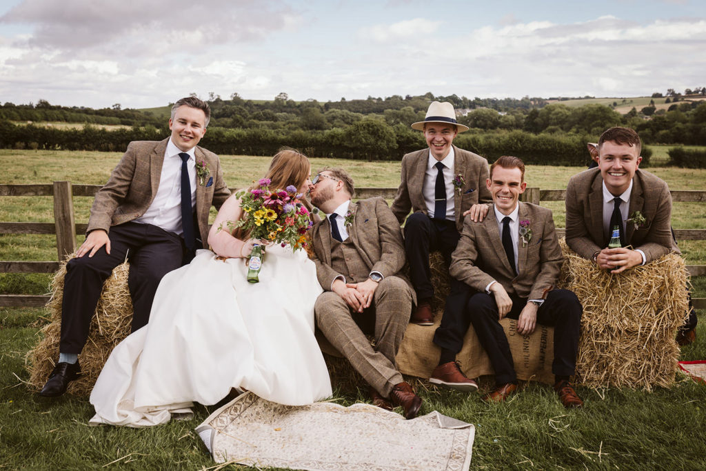 Group shots on piled up hay bales.