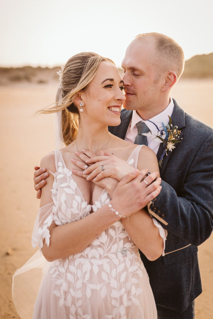 Newlyweds enjoying the beach at Newton Hall