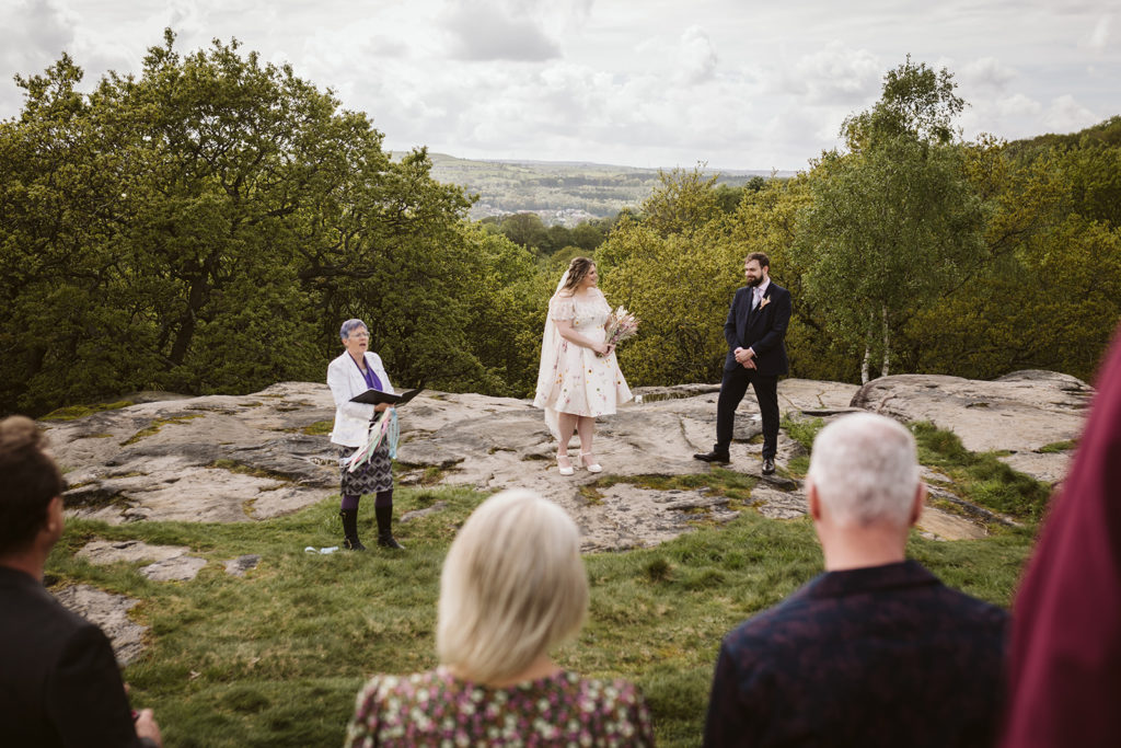 An outdoor wedding ceremony on the cliffs at Shipley Glen