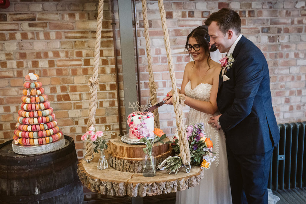 The Bride and Groom cutting the cake 