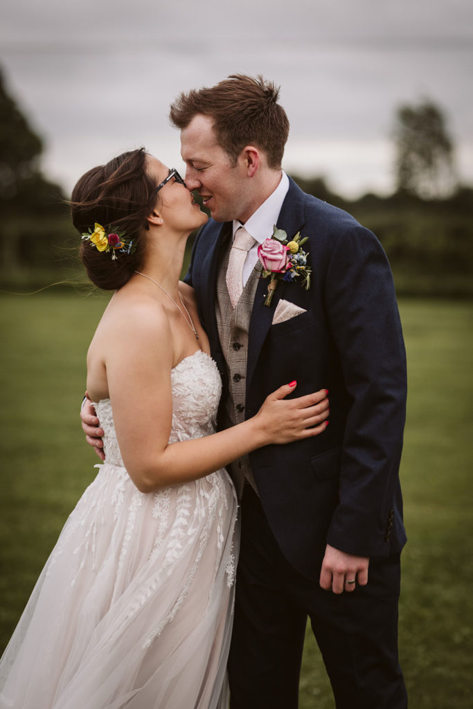 A romantic image of the Bride and Groom in the grounds of the Beverley Barn