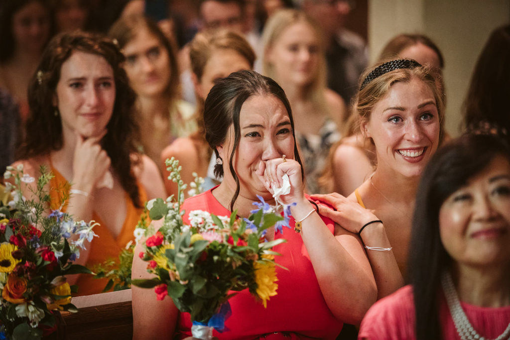 Emotional bridesmaids during the wedding ceremony