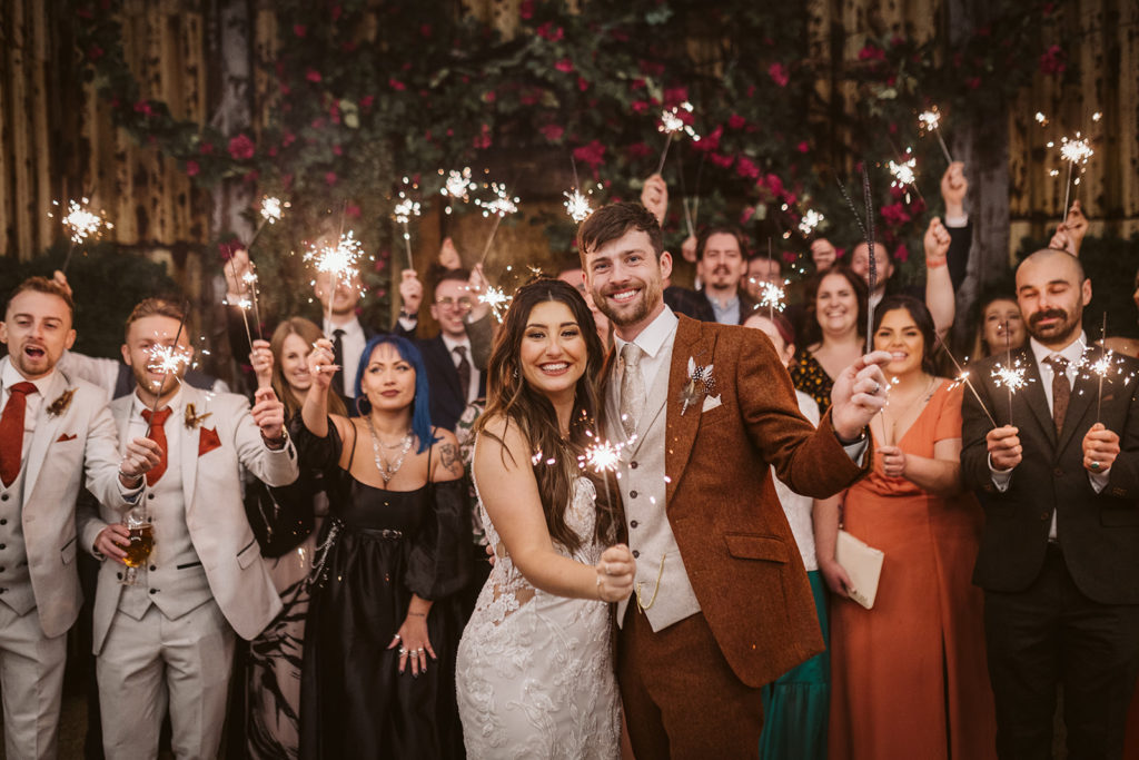 Group sparkler photos are a fun addition to the wedding evening celebrations
