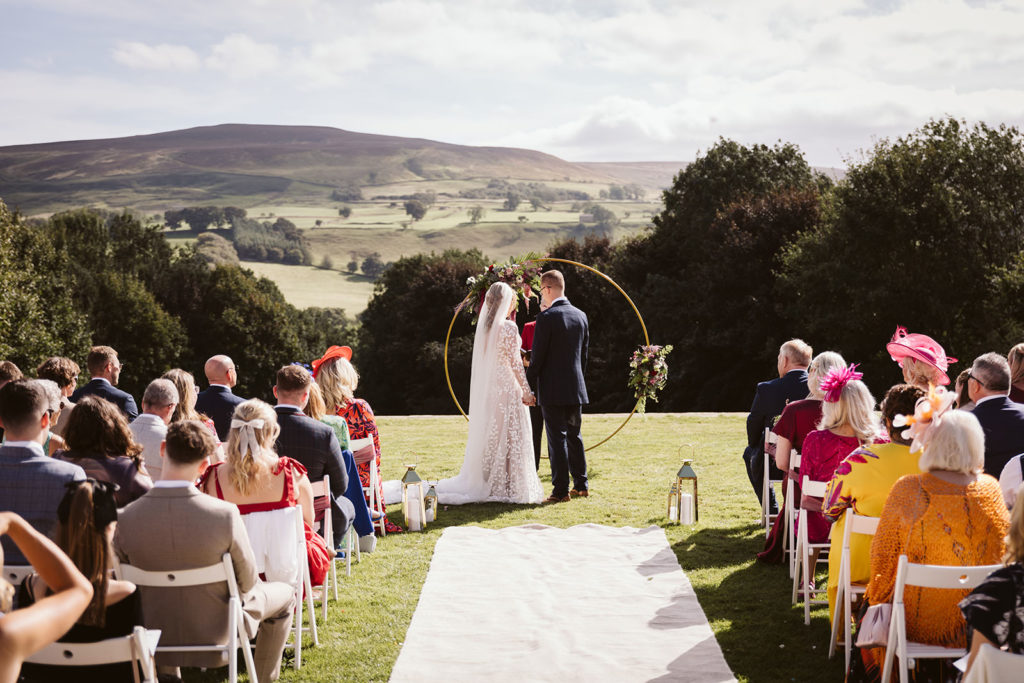 An outdoor ceremony with incredible views at the Saddle Room, North Yorkshire.