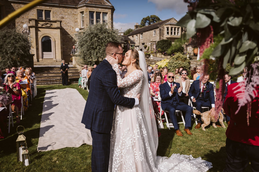 The Bride and Groom share their first kiss as a married couple