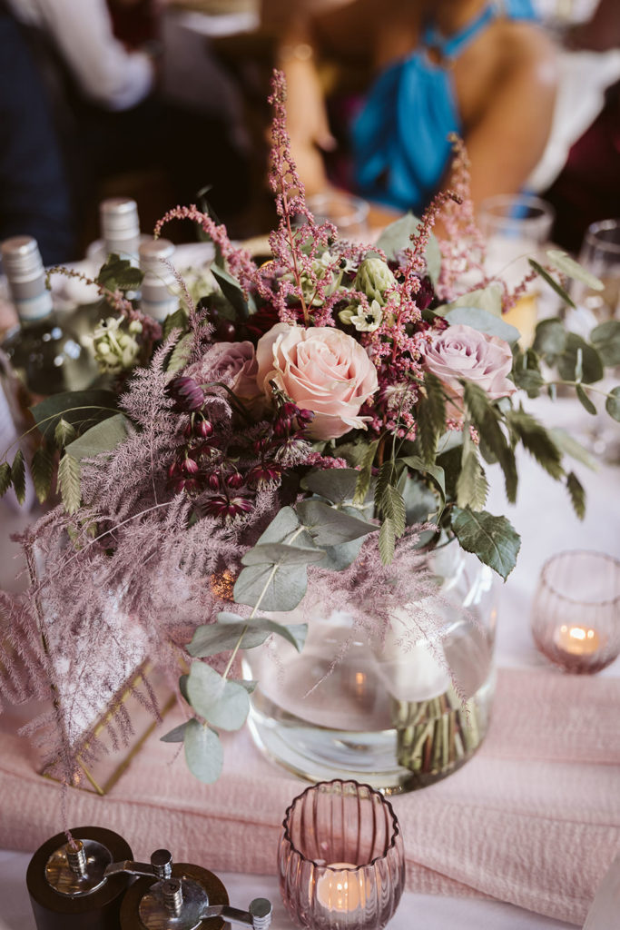 Bridesmaid bouquets repurposed as table centrepieces