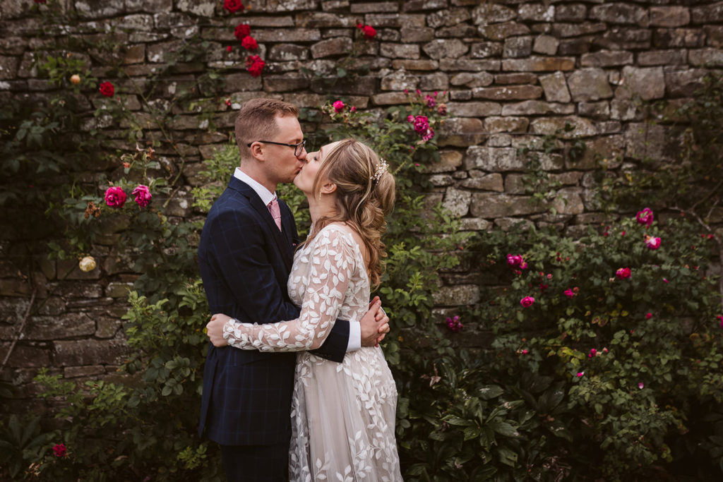 The Bride and Groom share a kiss