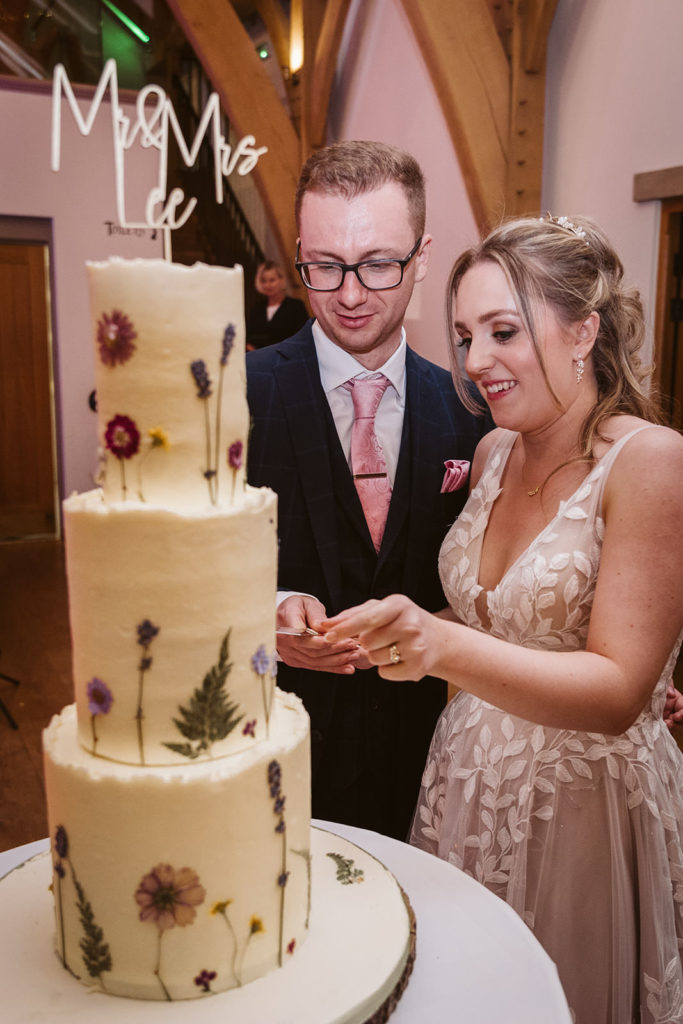 The newlyweds cut the cake