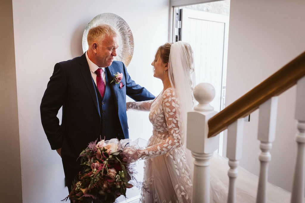 The Father of the Bride sees his daughter in her wedding outfit