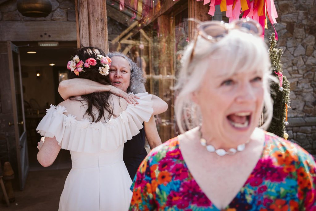 The bride embraces a guest