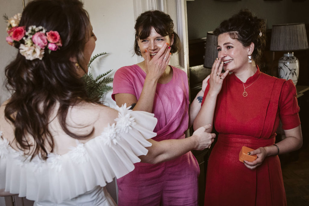 The first look and tears of happiness from the bridesmaids