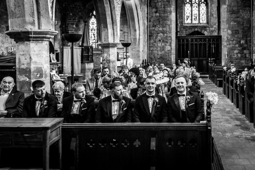 Groom and groomsmen waiting patiently at St Oswalds Church, Methley