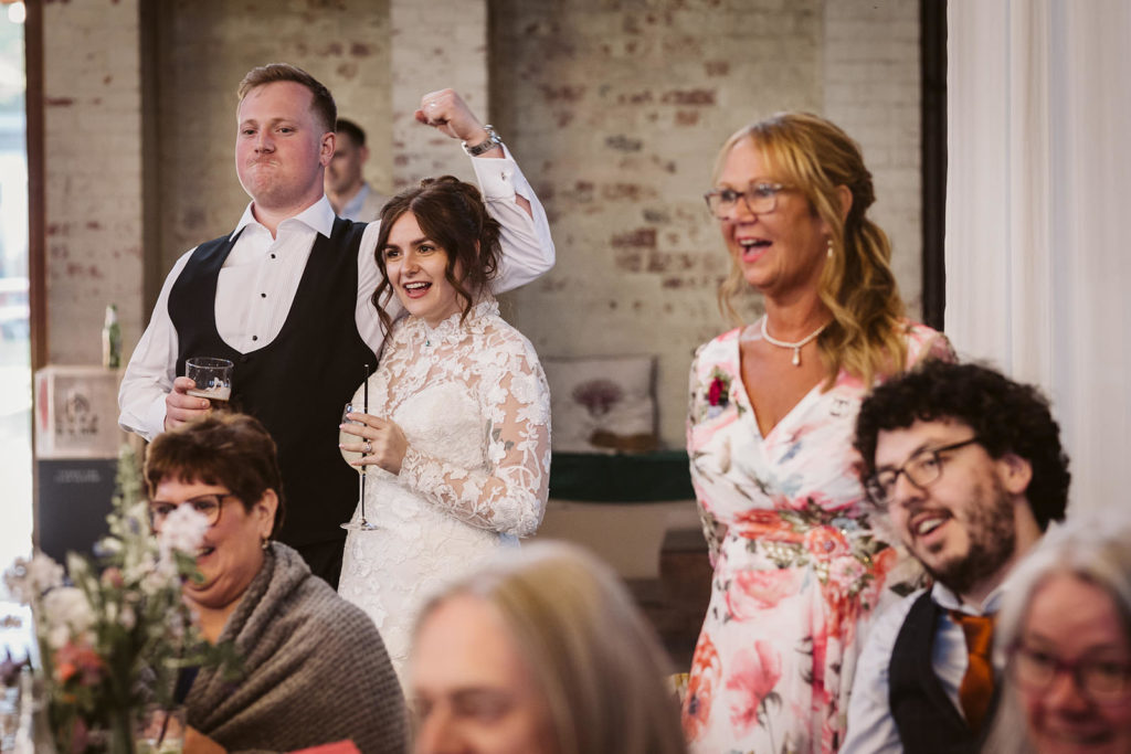The happy couple and guests react to the speeches
