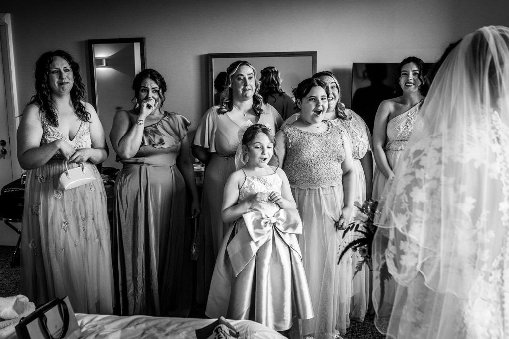 The big reveal - the bridal party react to the bride in her dress
