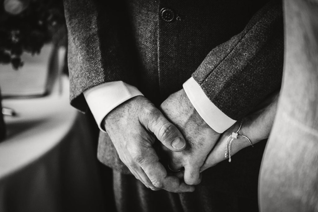 A close up of hands during the ceremony - documentary wedding photography