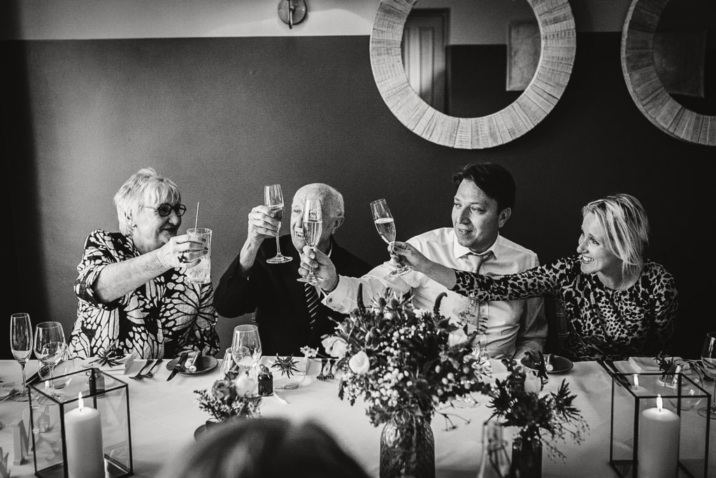 Guests celebrating during speeches at Yorebridge House Micro Wedding