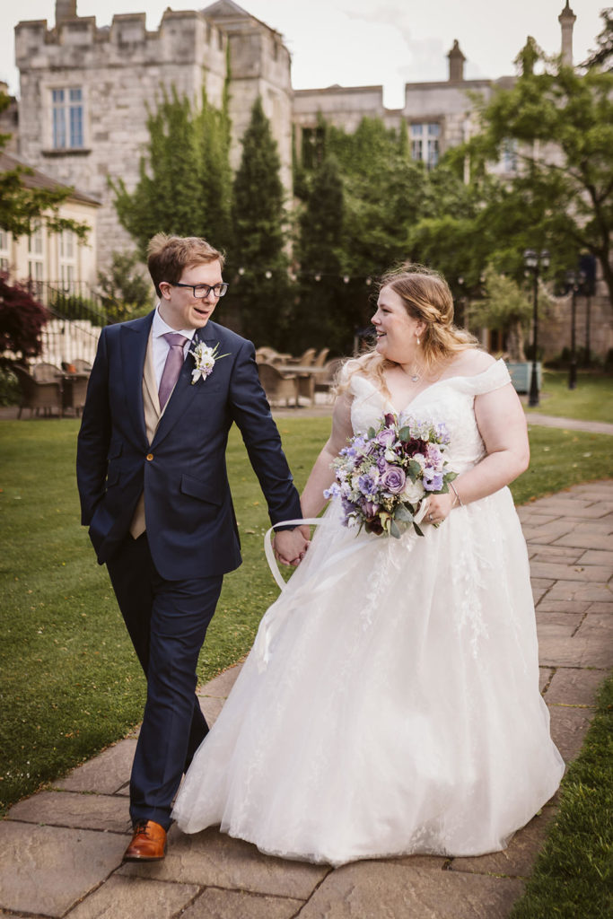 natural wedding photography of couple walking and talking Yorkshire venue