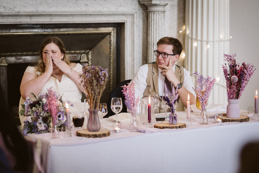 natural wedding photography of couple reacting during speeches Hazlewood Castle