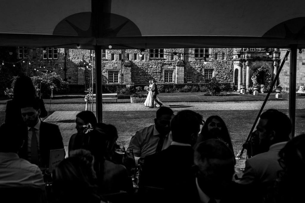 The Bride & Groom walk to their marquee wedding breakfast at this historic North yorkshire wedding venue