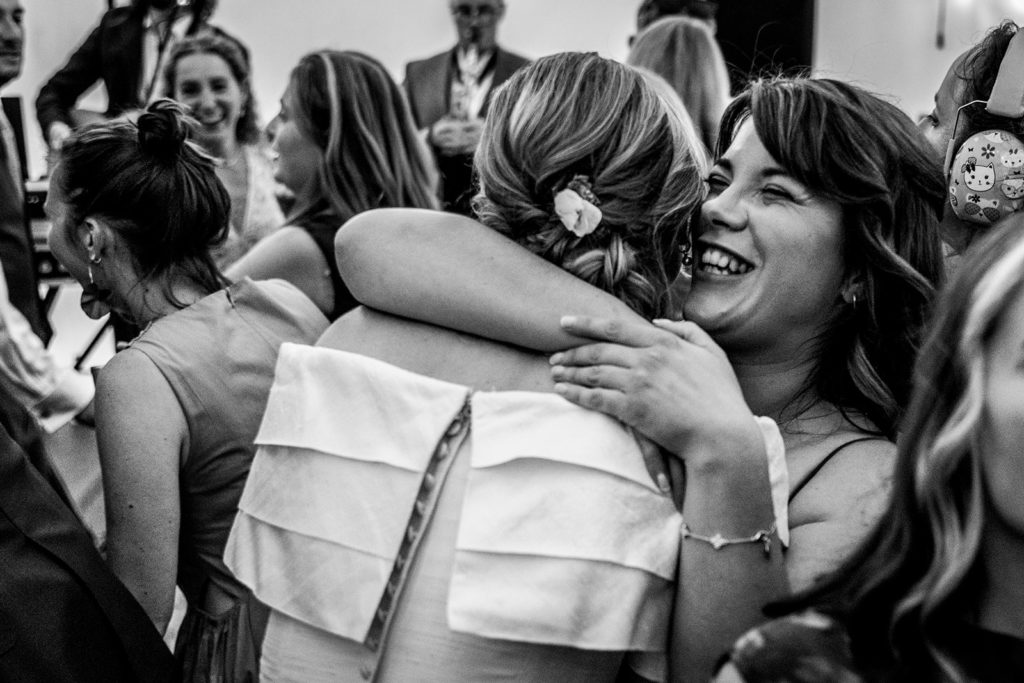 Evening wedding celebrations in marquee with lively atmosphere