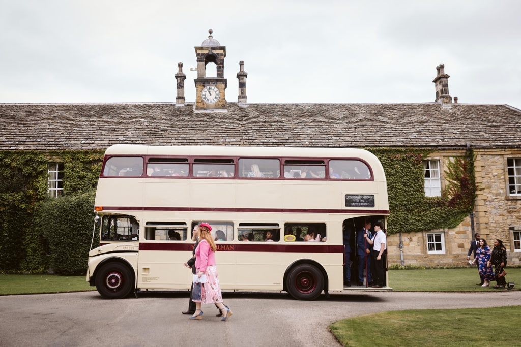 A vintage double decker bus transports guests from the church in Coxwold to Newburgh Priory