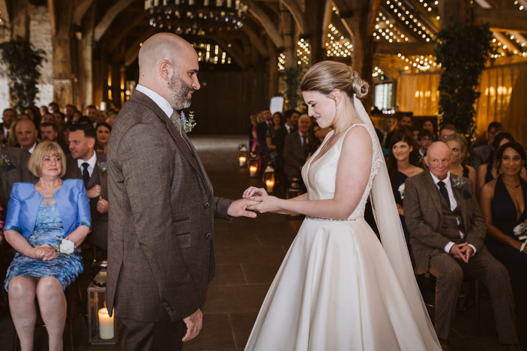 Natural wedding photography at Tithe Barn Bolton Abbey with candlelight and fairy lights.