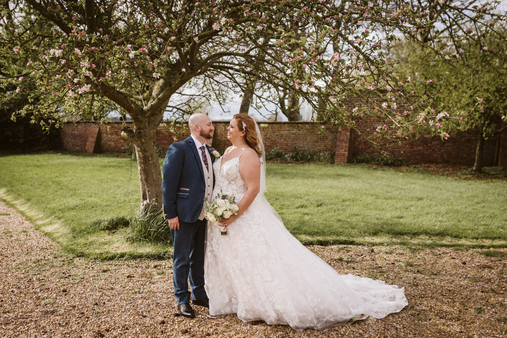 Couple portraits under the spring  blossoma