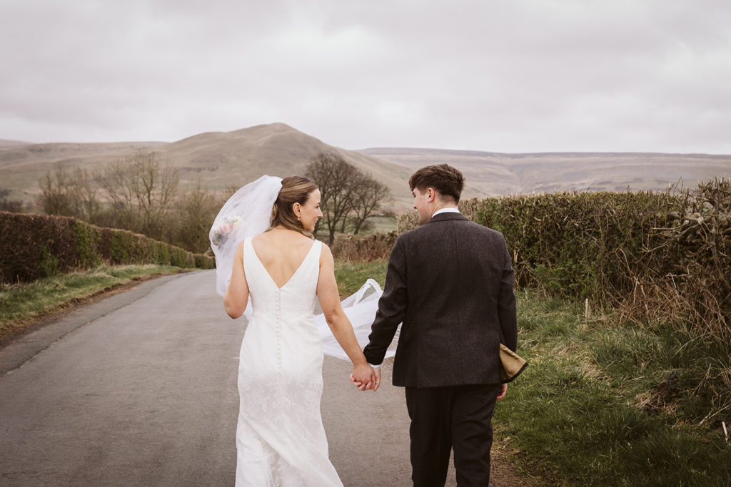 Natural candid wedding photo relaxed couple laughing together