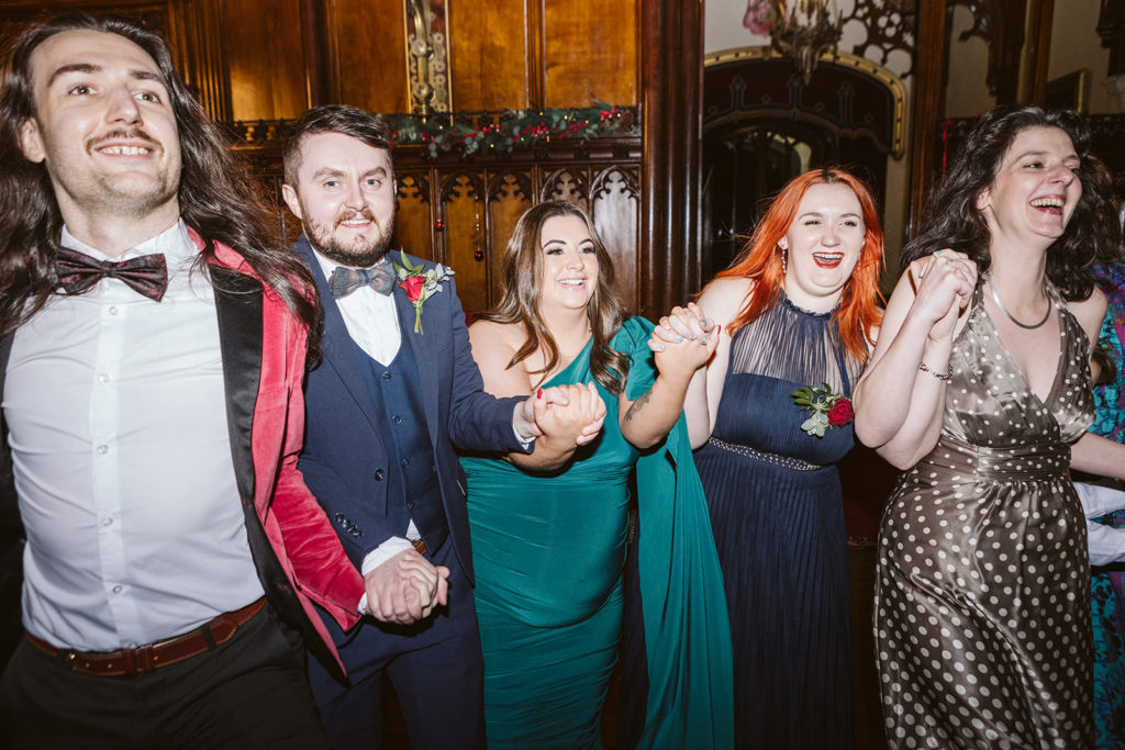 The Bride and Grooms friends having fun at this winter wedding