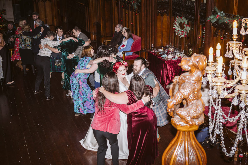 Packed dancefloor during winter castle wedding