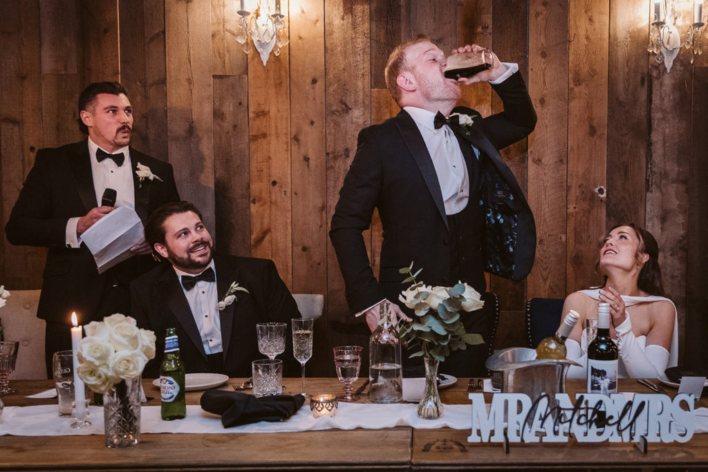 The best men challenge the groom to down a pint during their speech