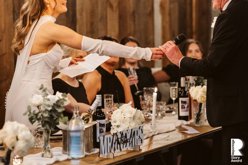 The Bride hands the microphone to her Dad