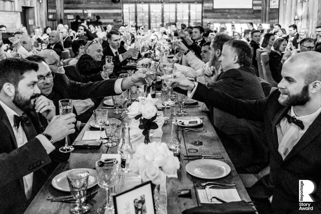 Guests join in with the toast