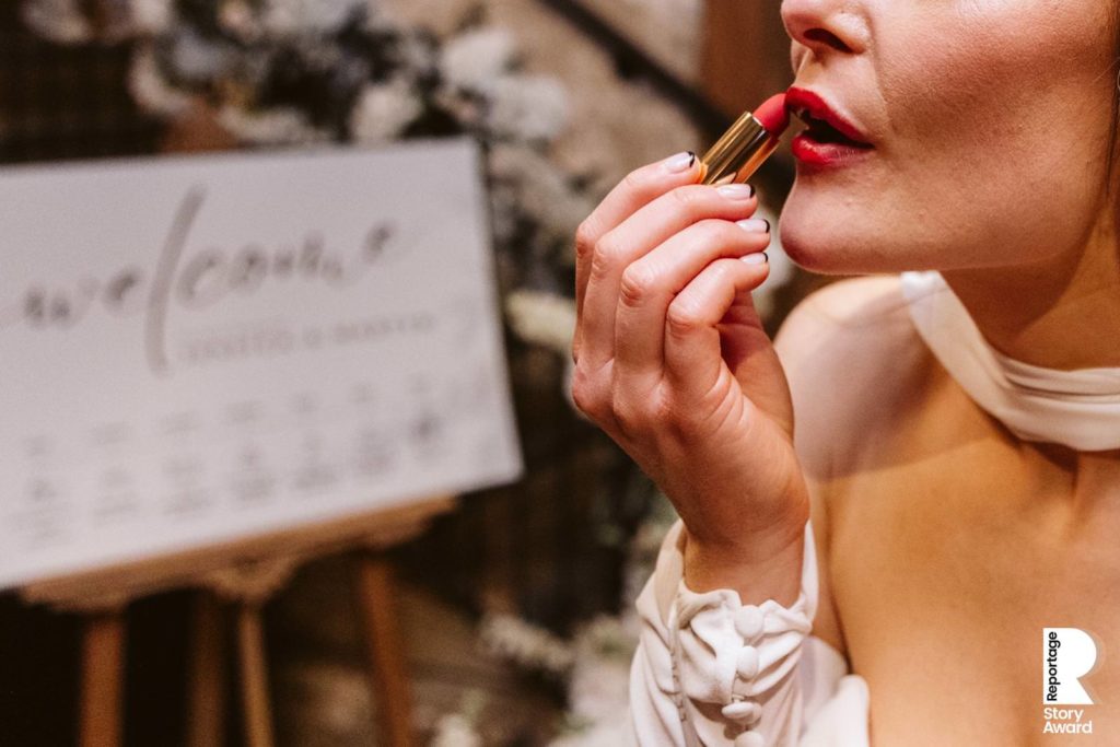The Bride touches up her lipstick