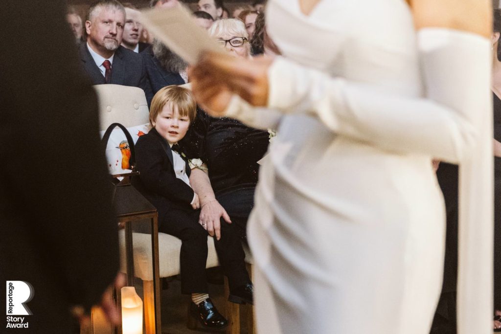 The happy couple's son watches on as his parents exchange vows