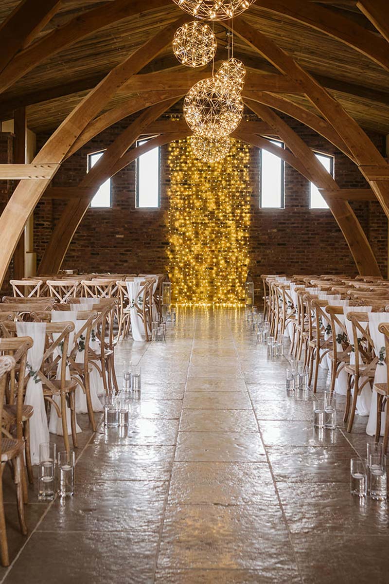 A wedding ceremony room at Oakwood at Ryther with dressed chairs